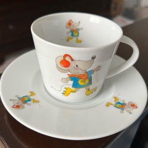 Porcelain cup and saucer set, skating mouse